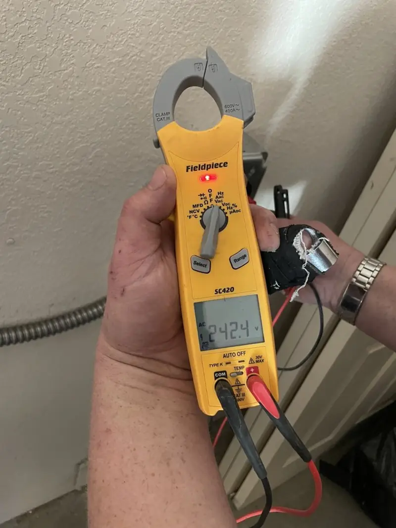 Voltage testing with clamp meter during Generator Installation in Hampton